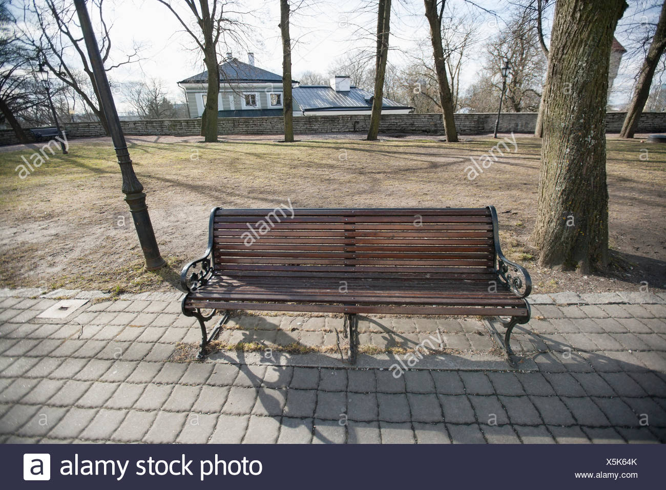 Wooden Bench On Path In Park