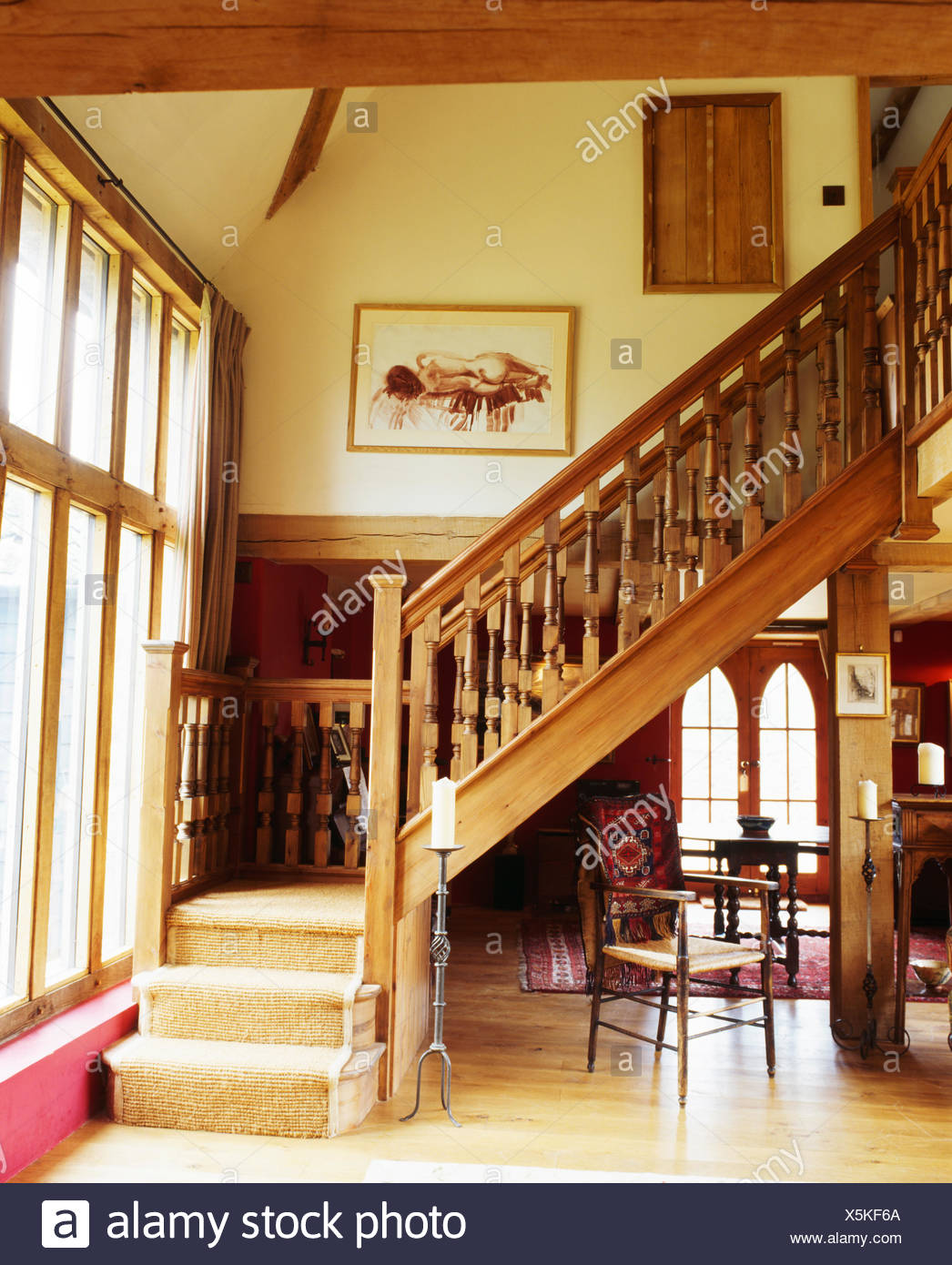 Carved Wooden Banisters On Staircase With Cream Carpet In Large