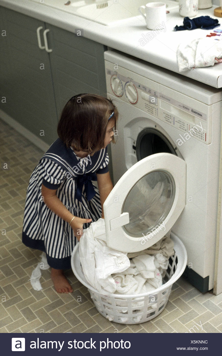 Child Washing Machine Stock Photos & Child Washing Machine Stock Images