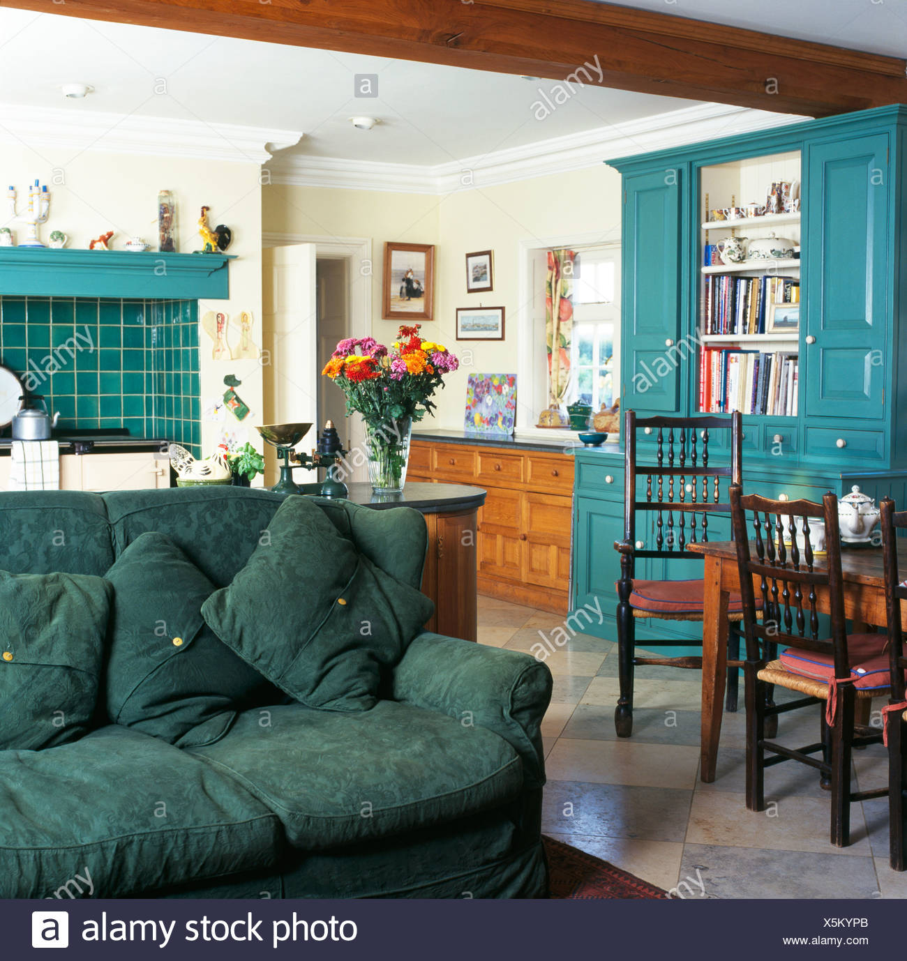 Green Sofa In Traditional Country Kitchen Dining Room With
