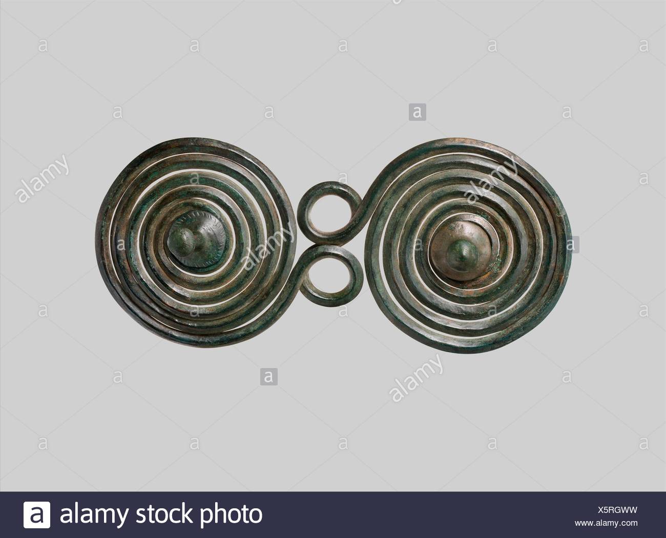 Large Brooch with Spirals. Date: 1400-1100 B.C; Culture: European Bronze  Age; Medium: Copper alloy; Dimensions: Overall: 10 3/16 x 4 1/2 x 3 1/16 in  Stock Photo - Alamy