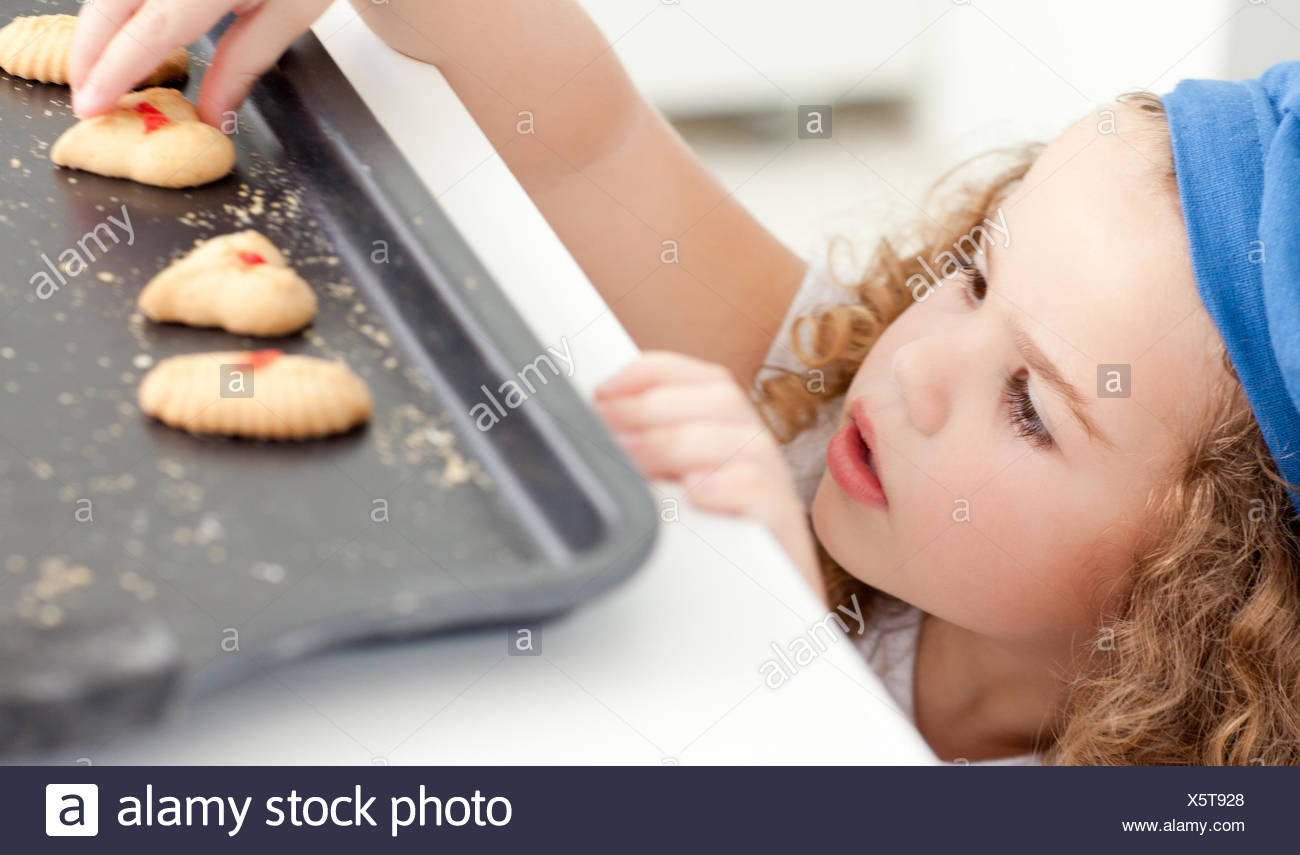 Little Girl Stealing Cookies High Resolution Stock Photography and ...