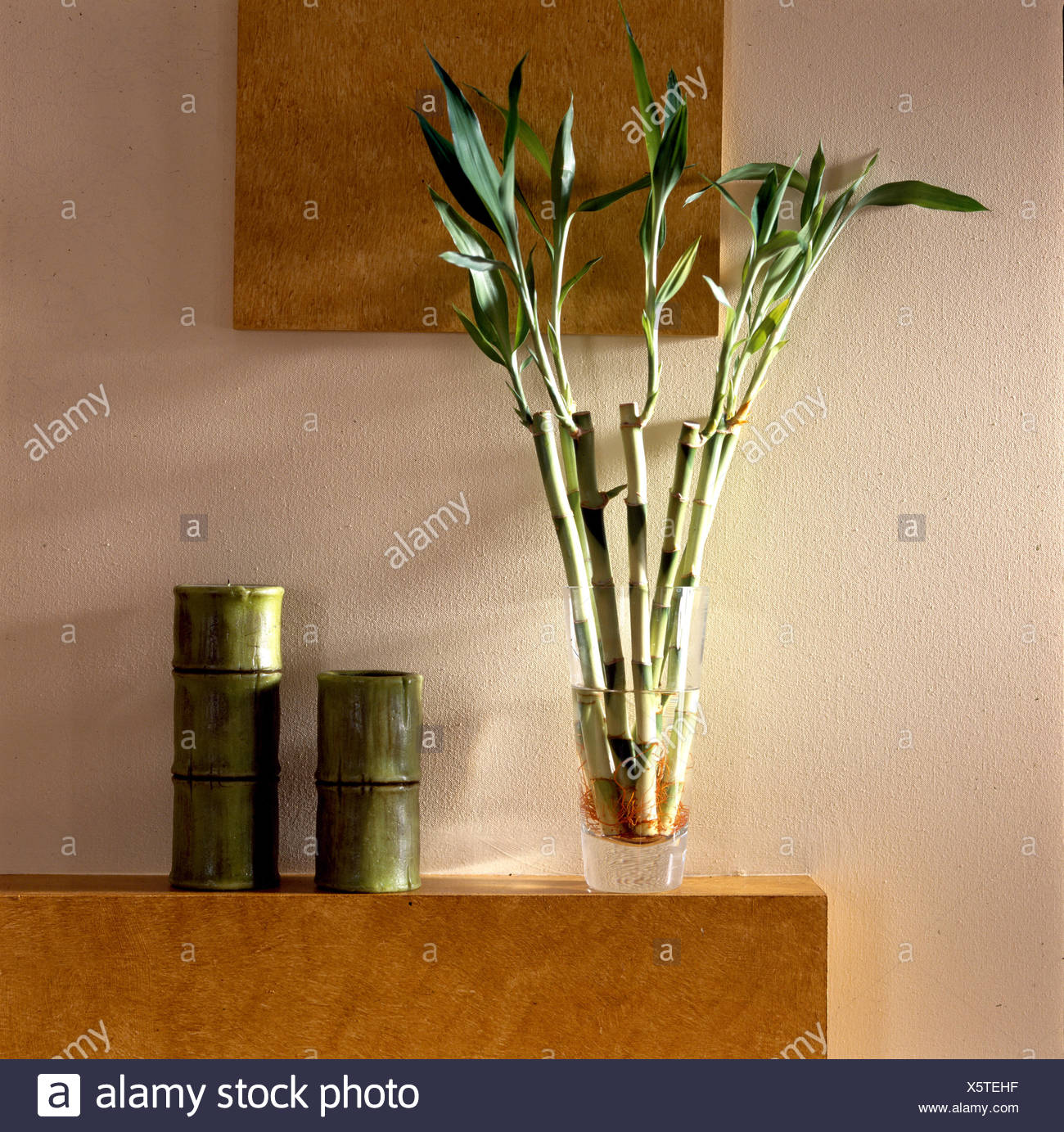 Bamboo Vases And Bamboo In Glass Vase On Modern Mantlepiece Stock