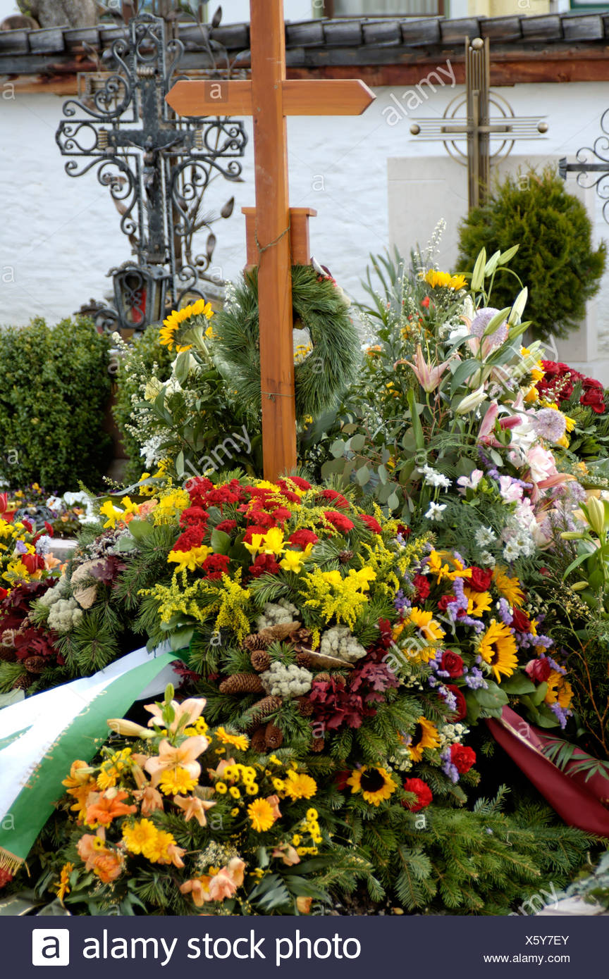 Funeral New Grave Flower Decoration At A Burial Stock Photo