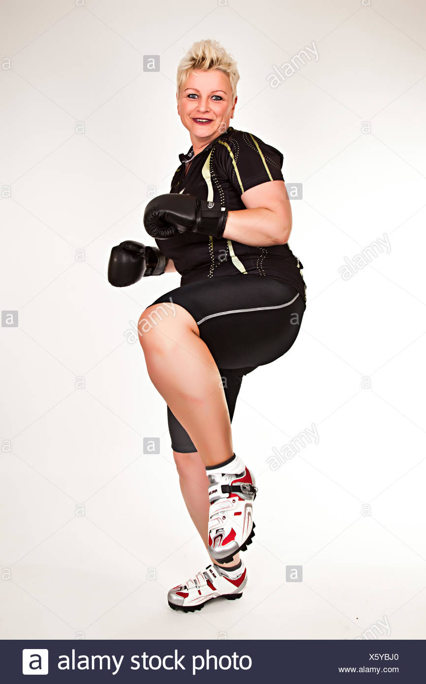 middelaged fitness woman boxing wearing boxing gloves and having fun Stock Photo
