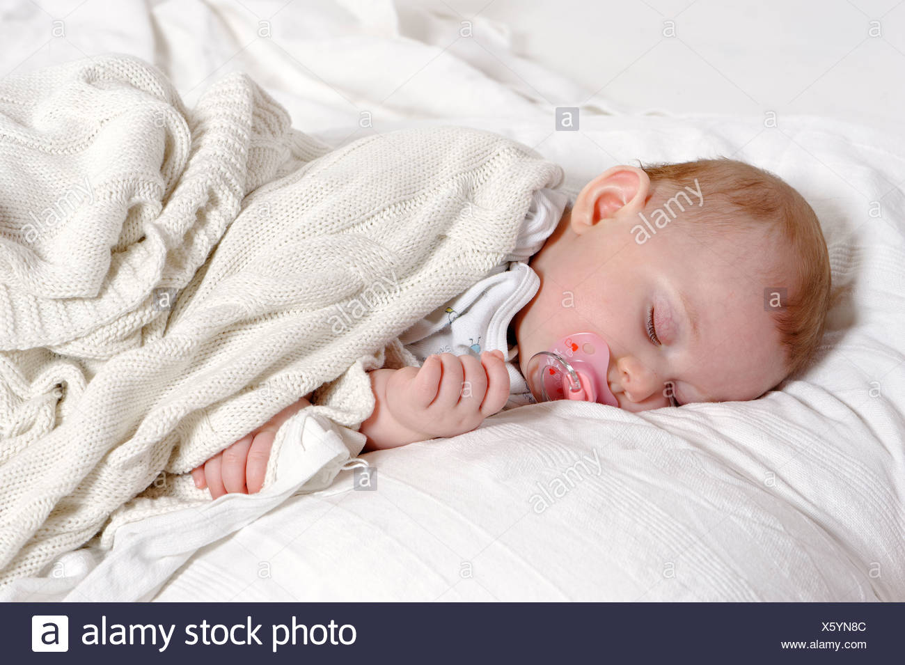 newborn sleeping with dummy