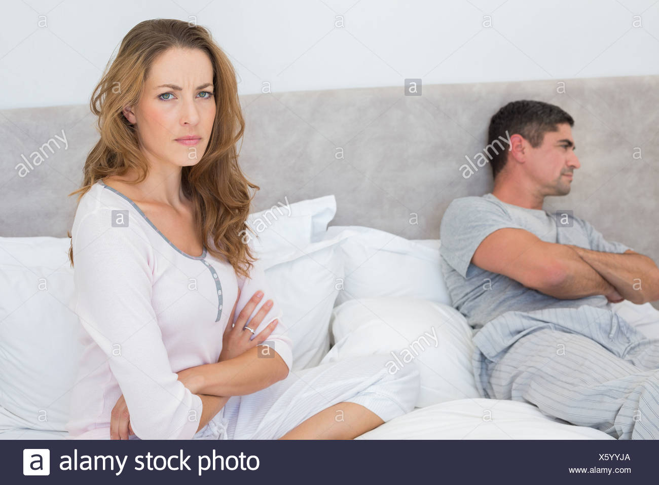 Angry woman with man in bed Stock Photo   Alamy