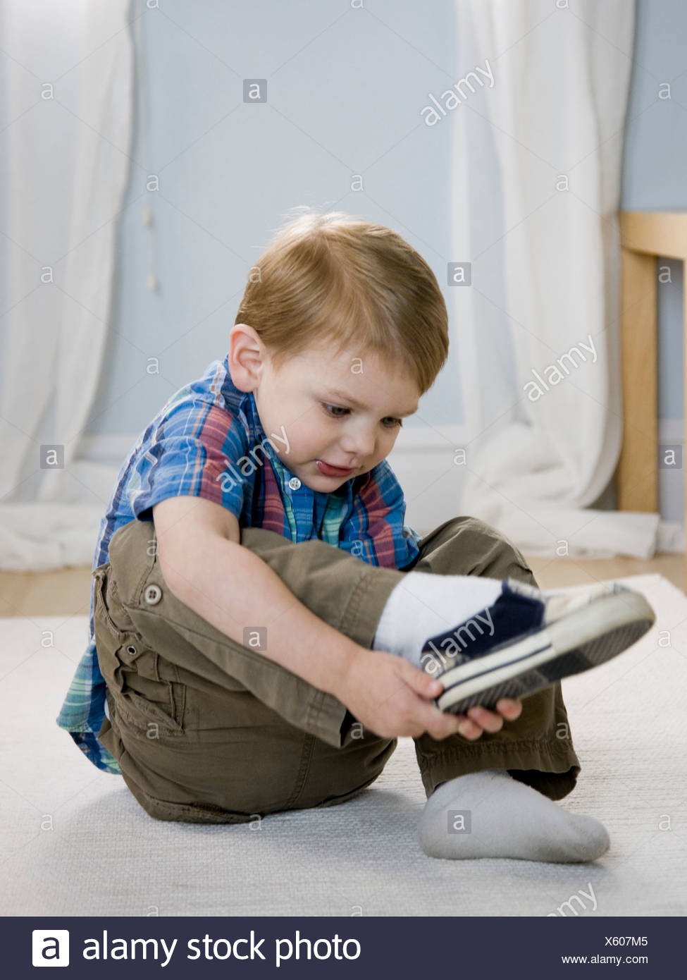 Boy Putting Shoes On Shoe Stock Photos & Boy Putting Shoes 