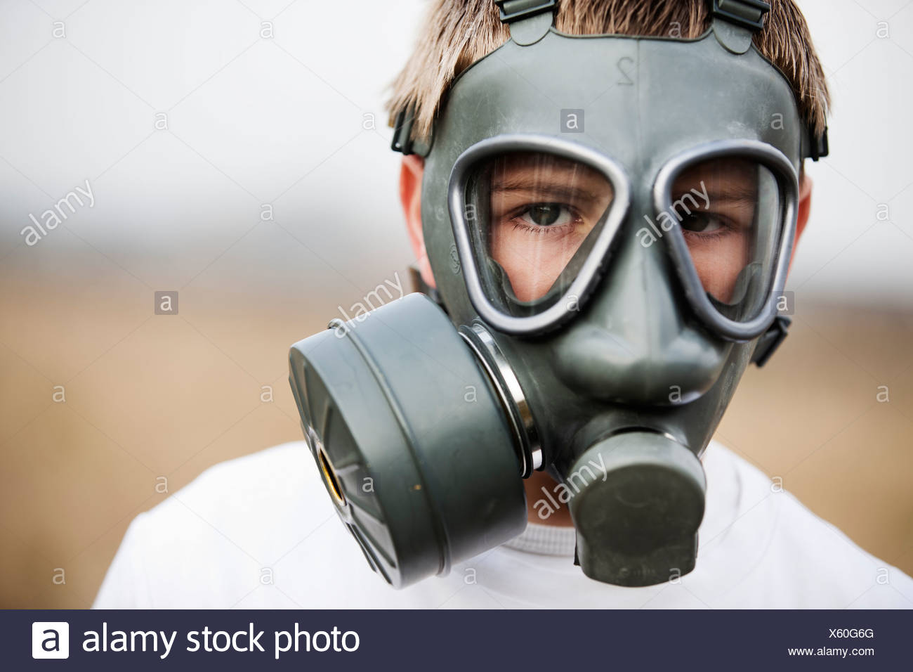 Close up of boy wearing gas mask Stock Photo