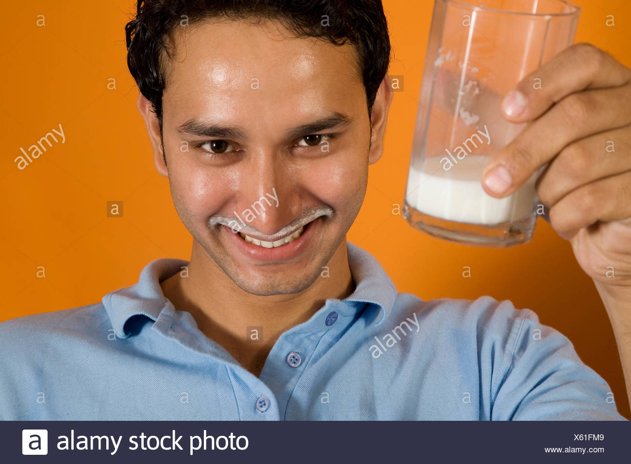 man-drinking-a-glass-of-milk-X61FM9.jpg