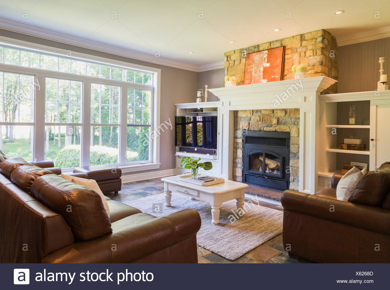 Brown Leather Sofa Sitting Chairs And Natural Stone Fireplace In