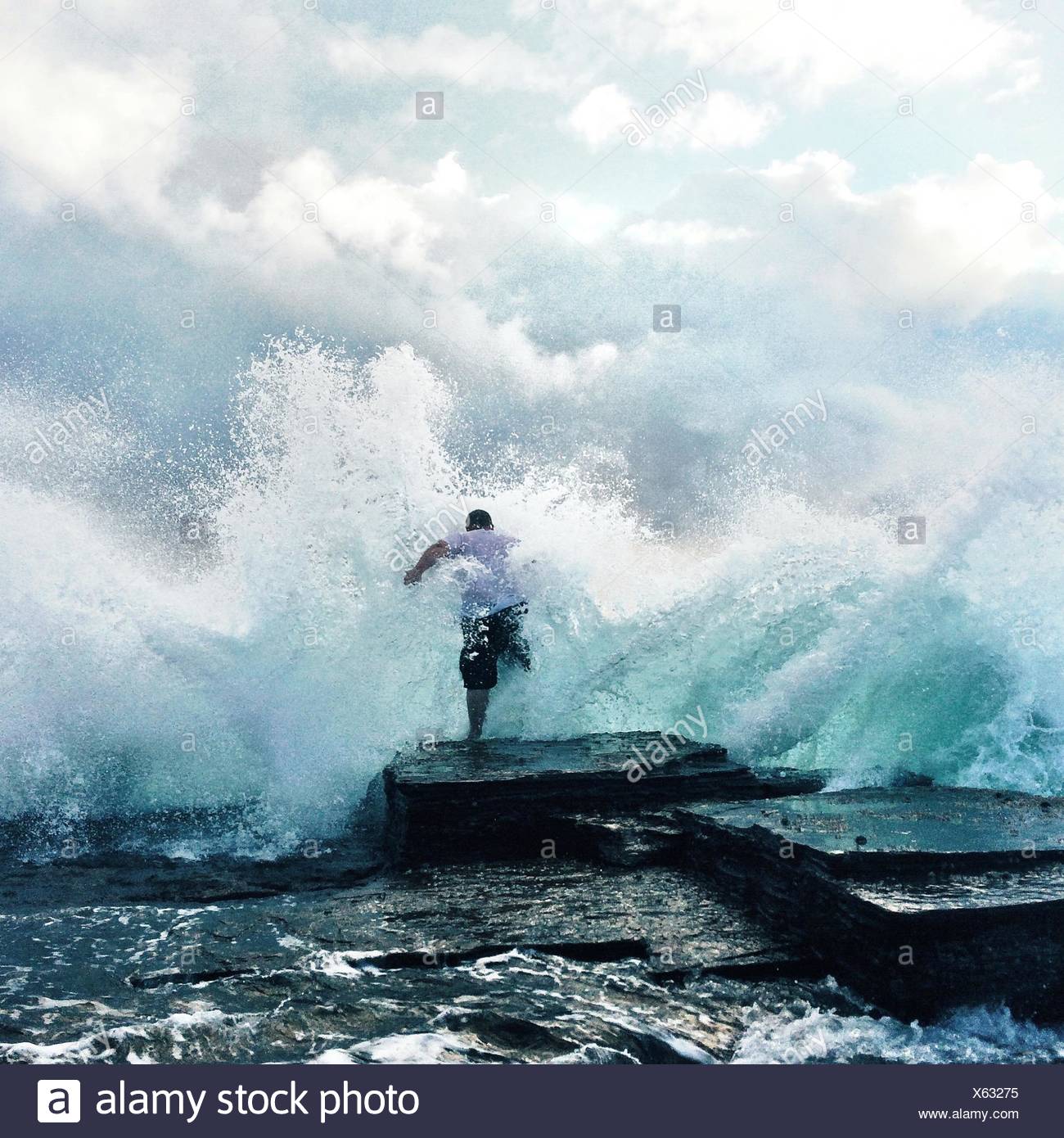 Waves Crashing Rocks Stock Photos & Waves Crashing Rocks Stock Images