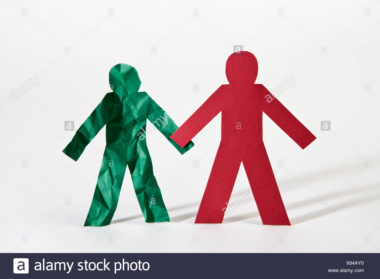 Paper Dolls Holding Hands High Resolution Stock Photography and Images