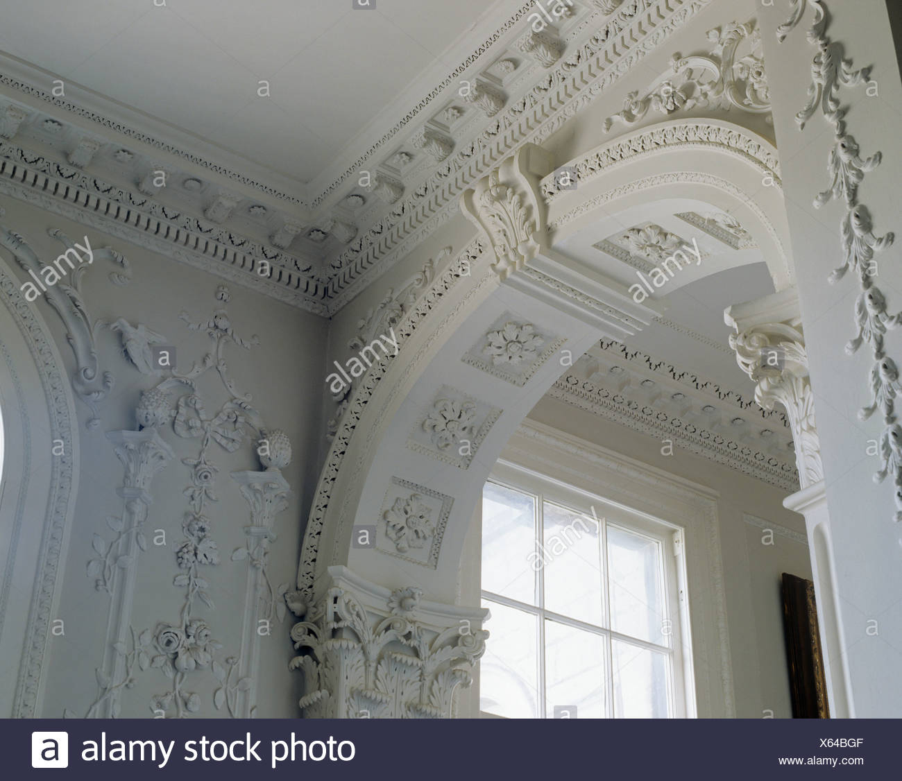 Arch In Large Country House Hall With Ornate Rococo Plasterwork On