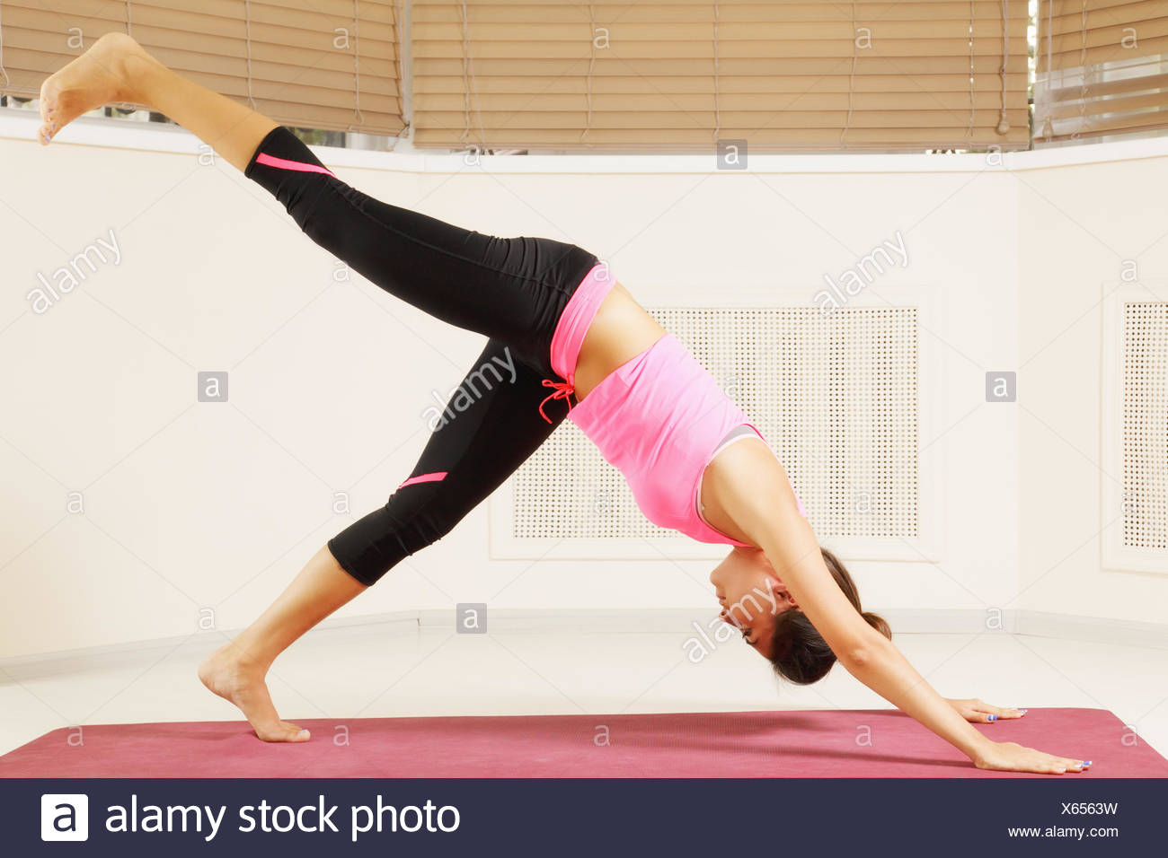 Yoga pose one leg up Stock Photo - Alamy Yoga pose one leg up Stock Photo - Alamy