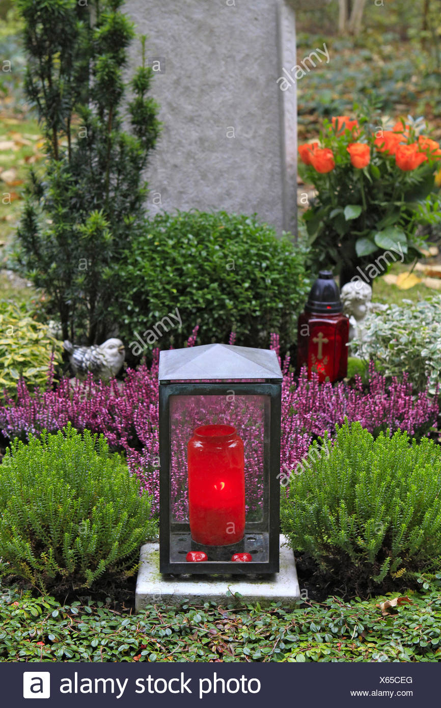 Geschmuecktes Grab auf einem Friedhof an Allerheiligen Stock Photo