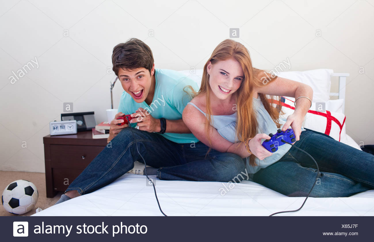 girl and boy playing video games