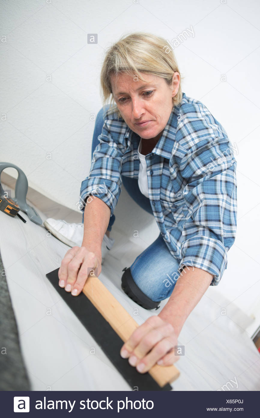 Woman Fitting A Linoleum Floor Stock Photo 279180850 Alamy
