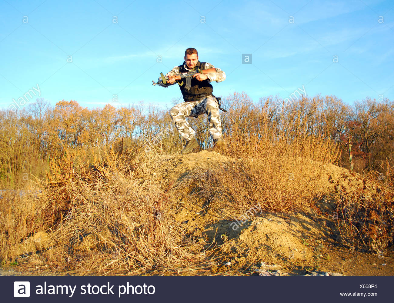 Man Gun Running Stock Photos & Man Gun Running Stock Images Alamy