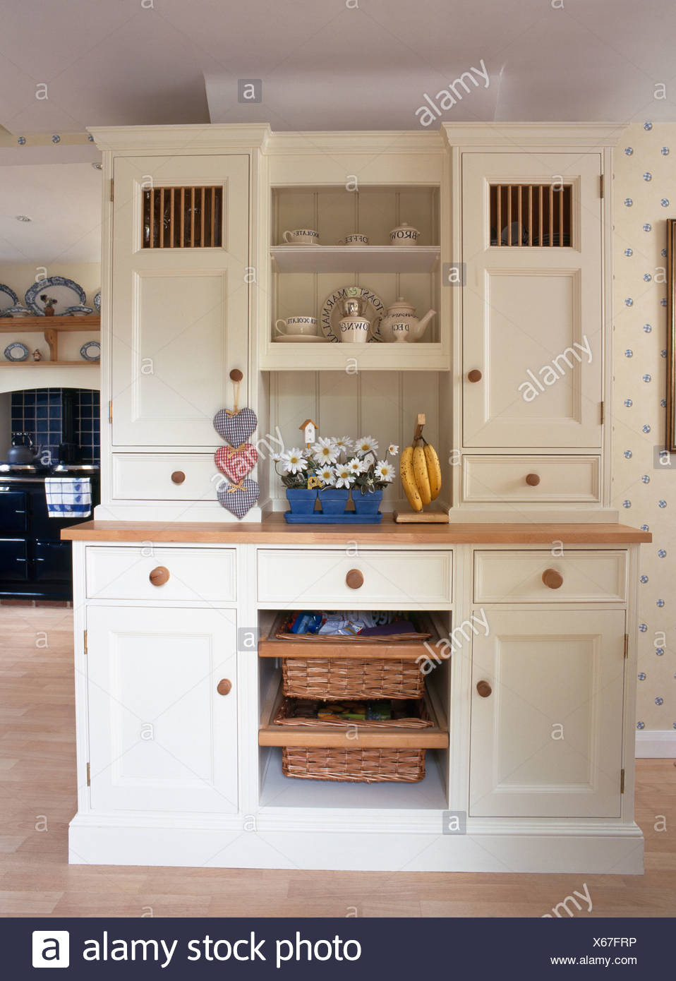 Cream Fitted Kitchen Dresser With Integral Storage Baskets In