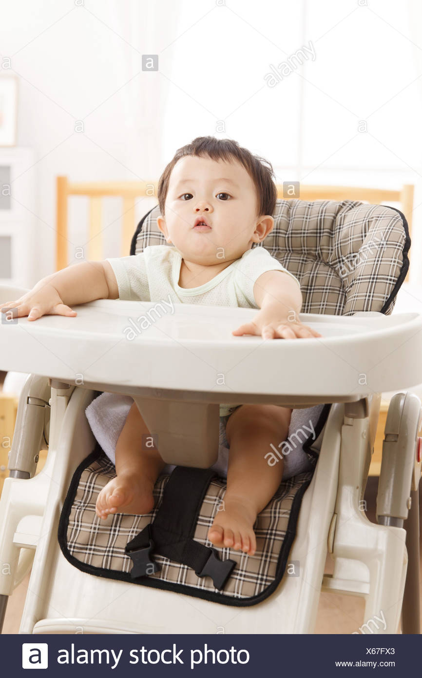 baby sitting on chair