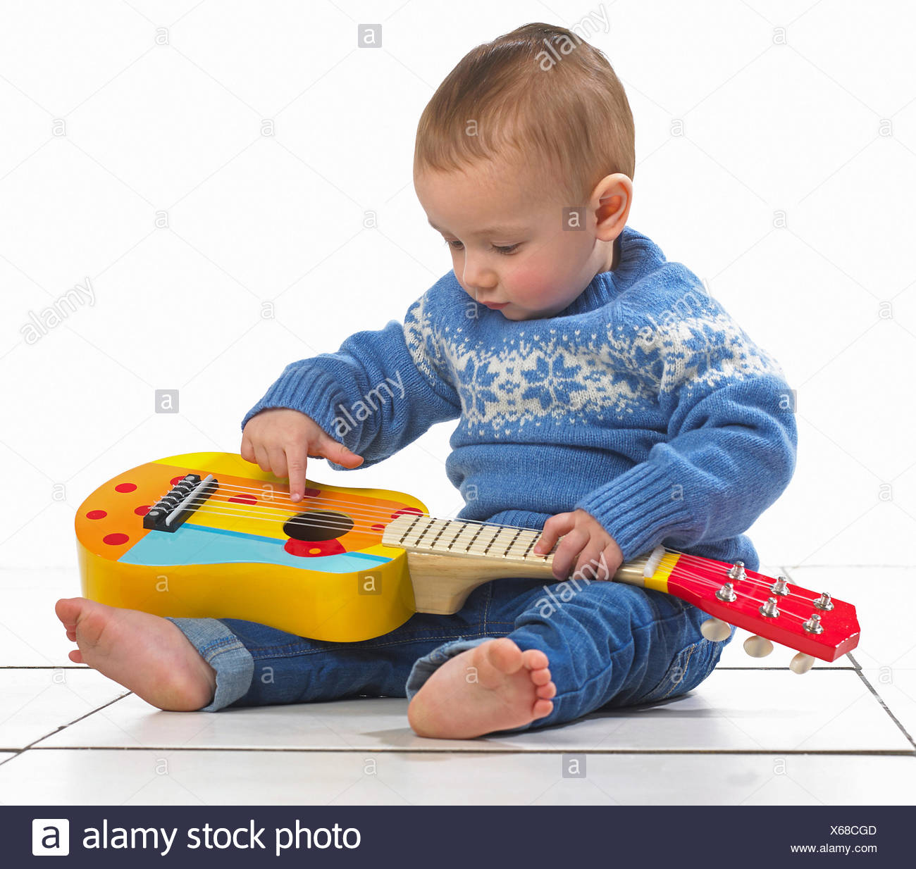 Boy Playing Toy Guitar Stock Photos & Boy Playing Toy Guitar Stock