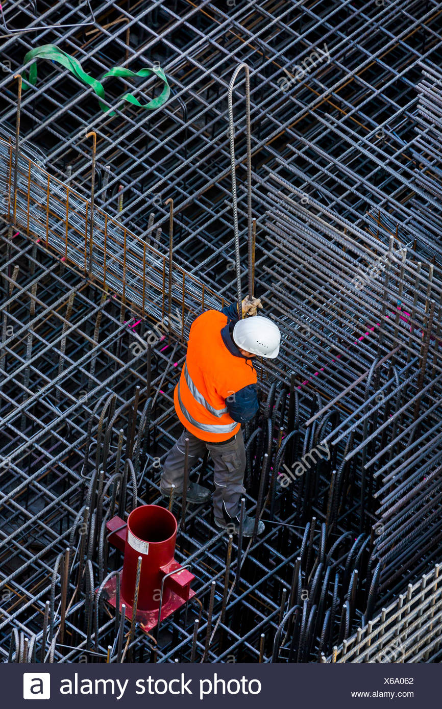 Construction Workers Processing Reinforcing Steel For Reinforced