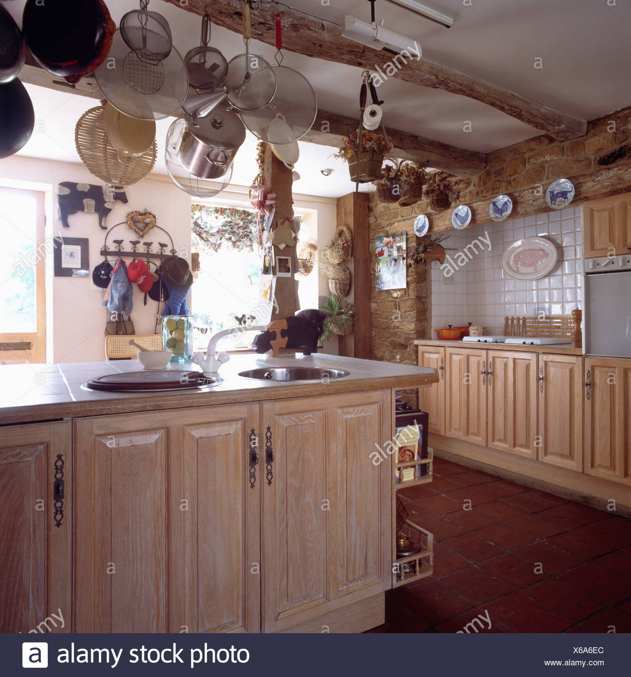 Country Cottage Kitchen With Wood Units And Pan Rack