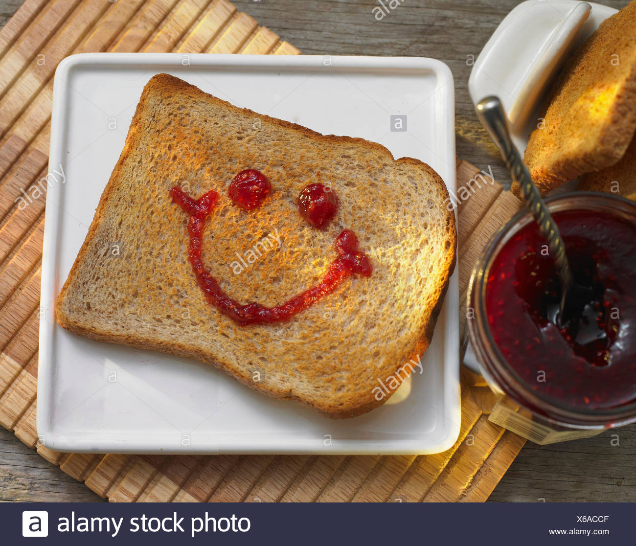 Slice Of Toast With Happy Face In Jam Stock Photo Alamy