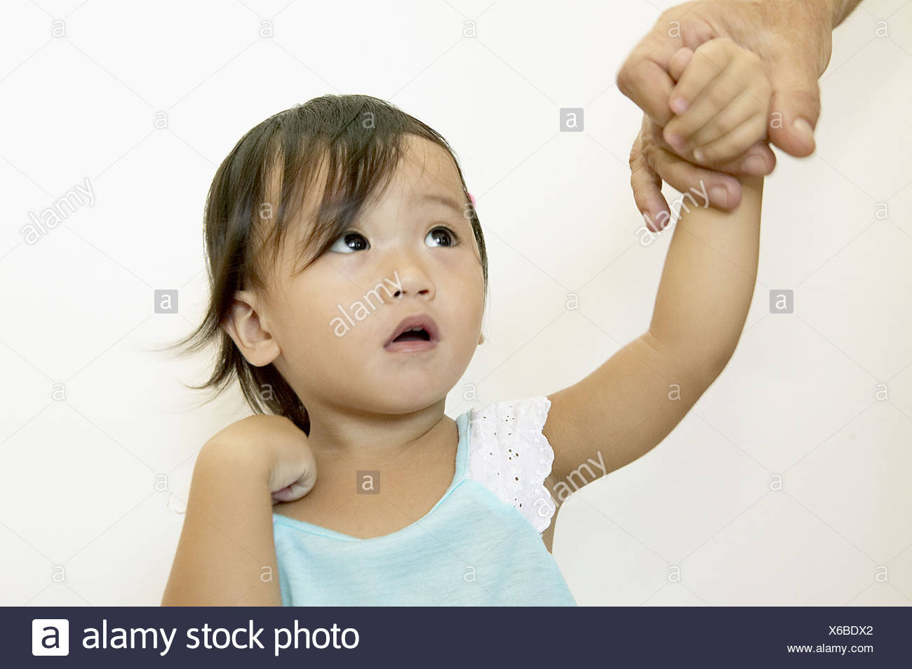 18 Month Old Half Chinese Philippines Girl Holding Father S Hand
