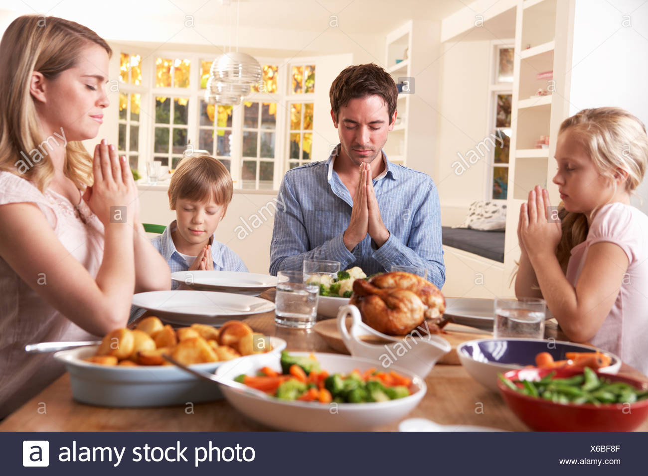 Family Praying Together Stock Photos & Family Praying Together Stock ...