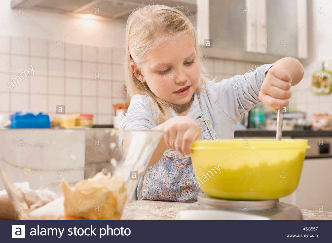 Girl Mixing Flour In Bowl For Cookies Stock Photo Alamy