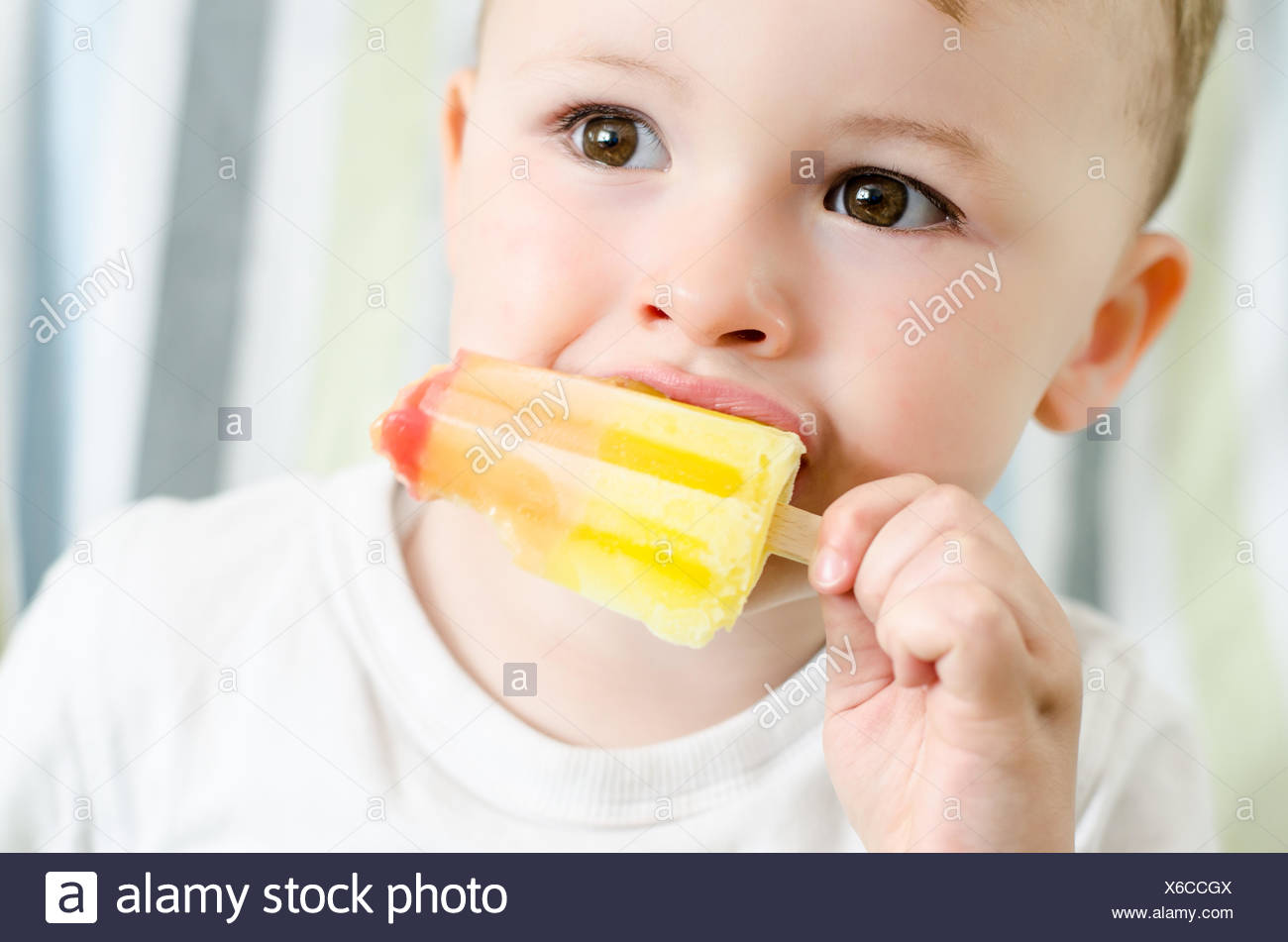 Baby Eating Ice Cream Isolated On White