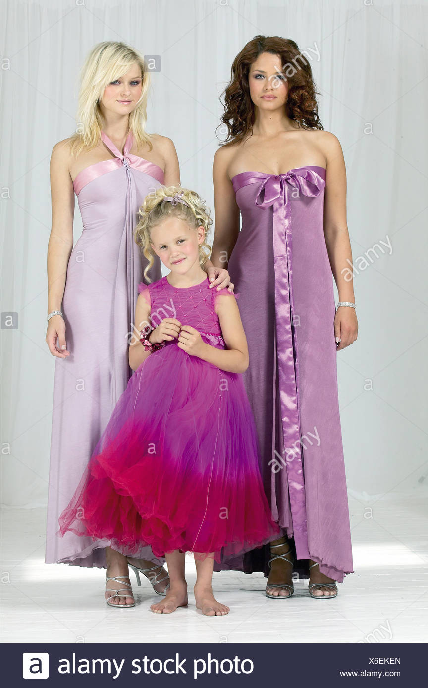 A Brunette Female Bridesmaid Curly Hair Wearing A Lilac Satin