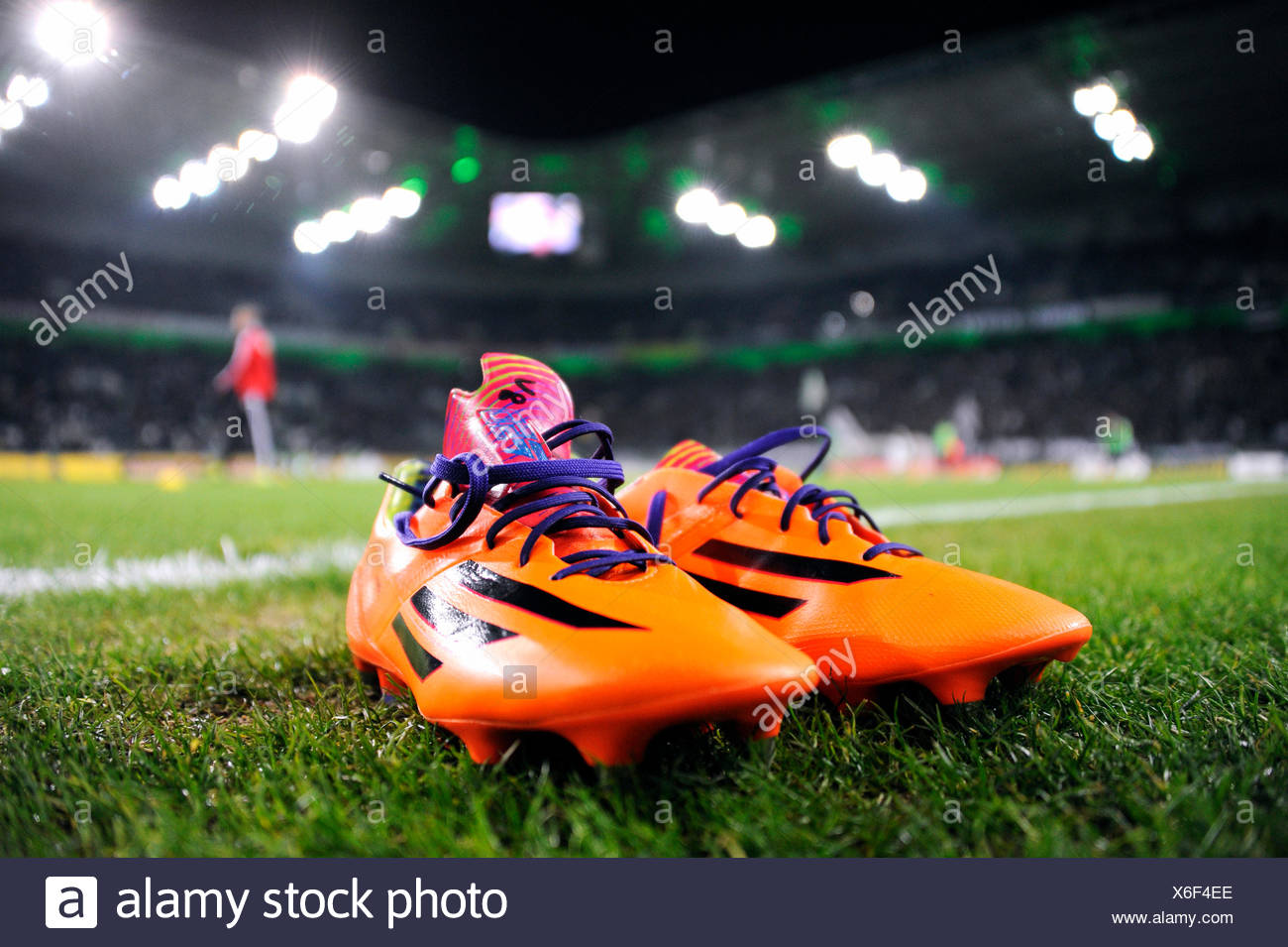 Orange-coloured Adidas football boots on the edge of the pitch,  Borussia-Park, Mönchengladbach, North Rhine-Westphalia, Germany Stock Photo  - Alamy