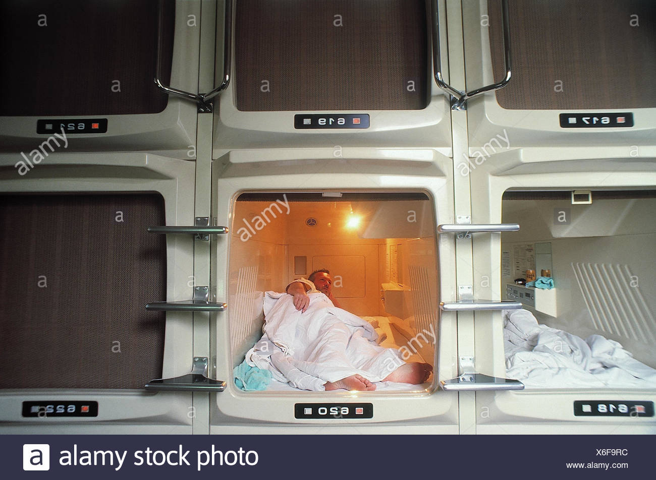 Japan Tokyo Hotel Man In Sleep Container Capsule Capsule Hotel Sleep Capsule Bed Sleep Uncomfortable Impersonally Stock Photo Alamy