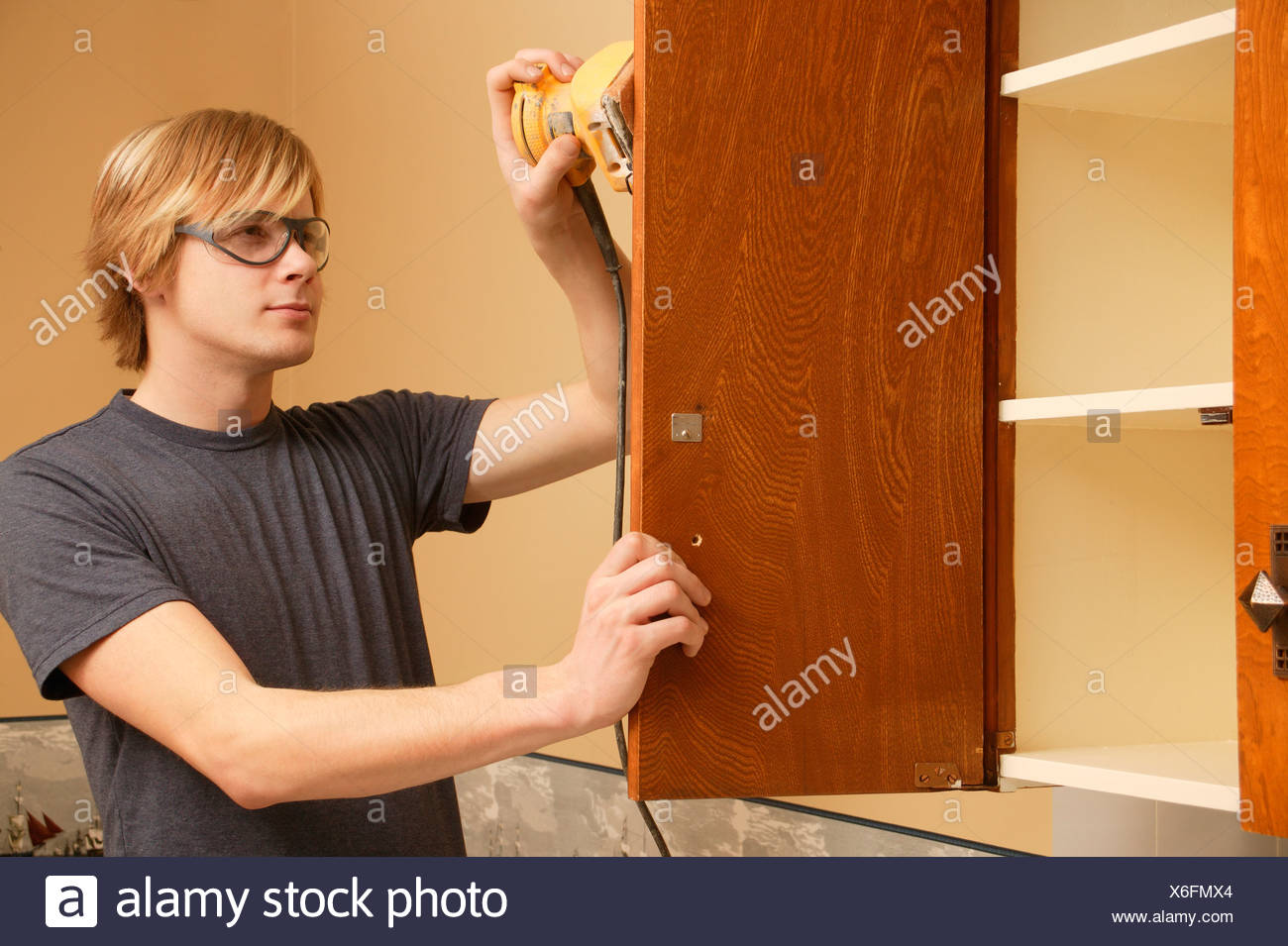 Man Sanding Kitchen Cabinets Stock Photo 279399516 Alamy