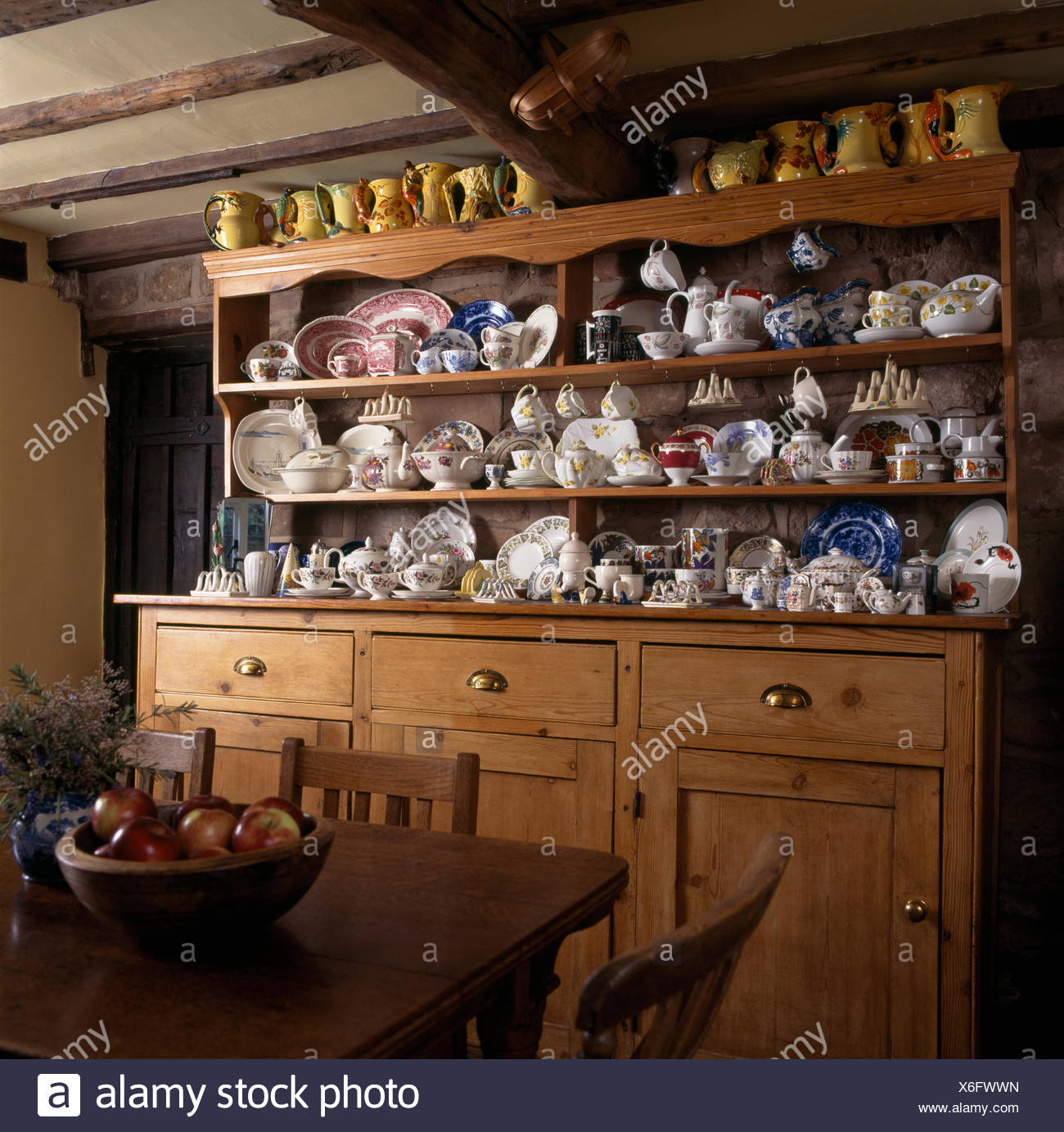 Old Pine Dresser With A Collection Of Vintage China In A Cottage