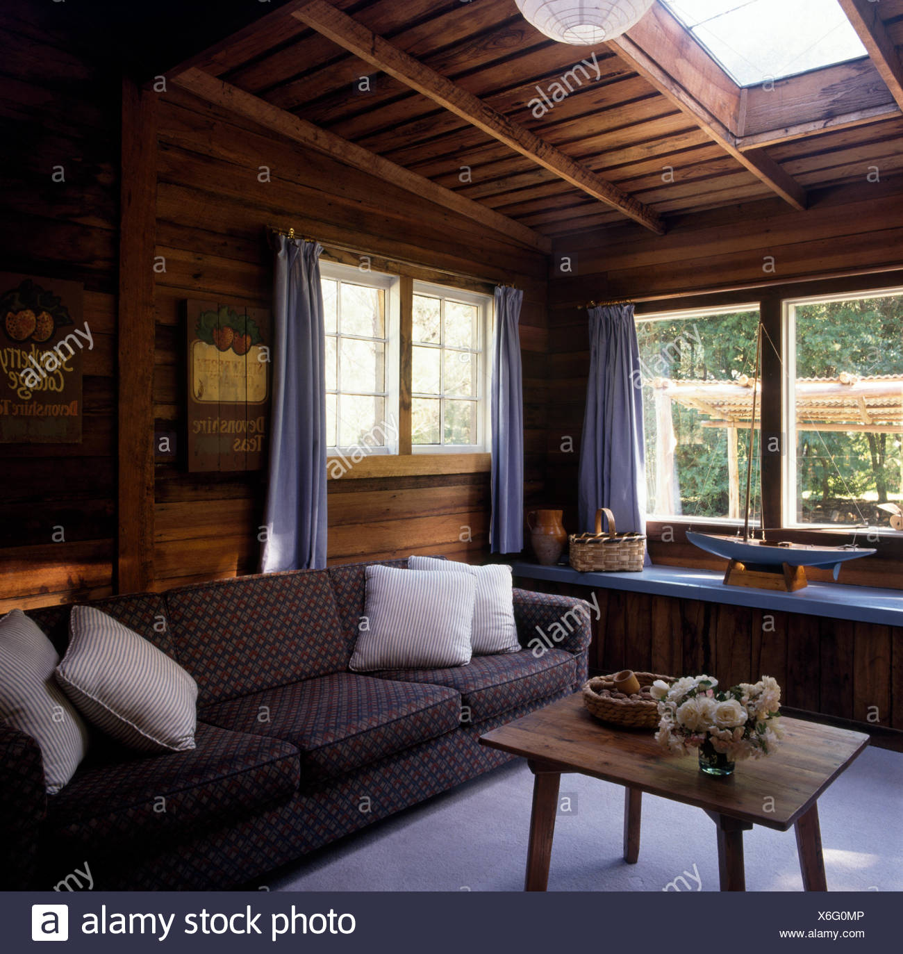 Wood Paneled Ceiling And Walls In Living Room With A Rustic