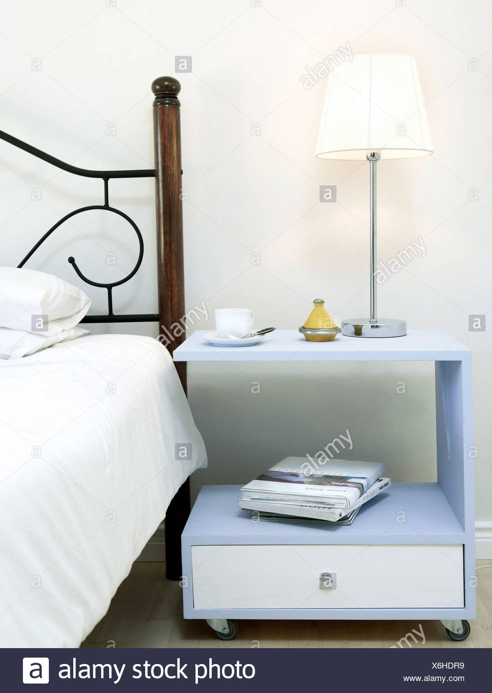 Bedside Matters Build A Bedside Table On Wheels That Doubles As A Work Surface Finished Bedside Table Painted Blue And White Stock Photo Alamy