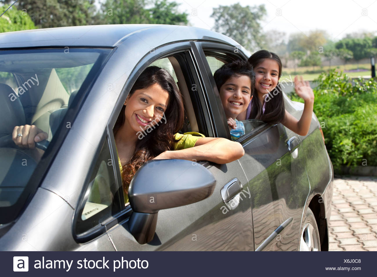 Portrait of mother and kids in a car Stock Photo