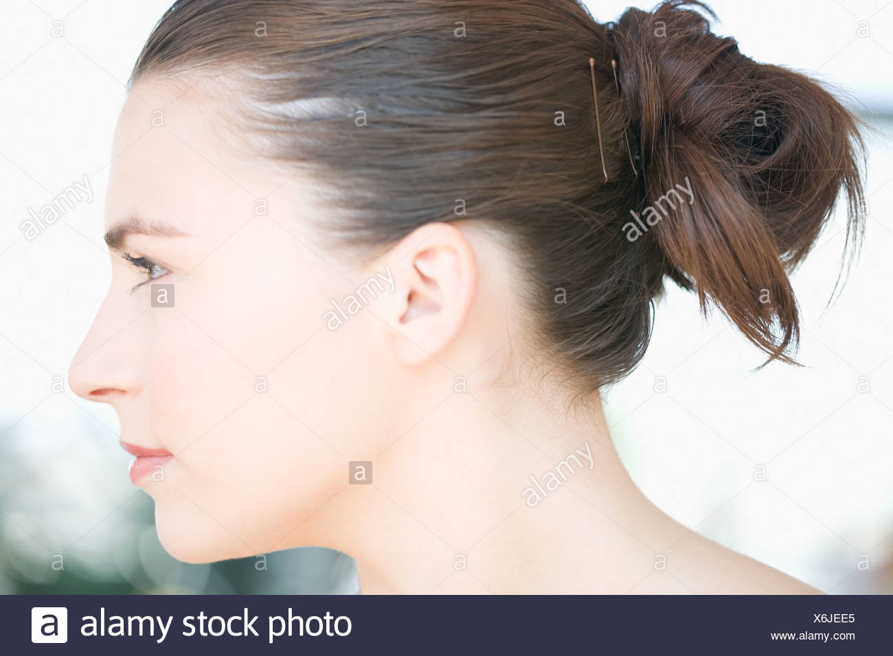 Profile Of Young Woman S Head With Hair Tied Back Stock Photo
