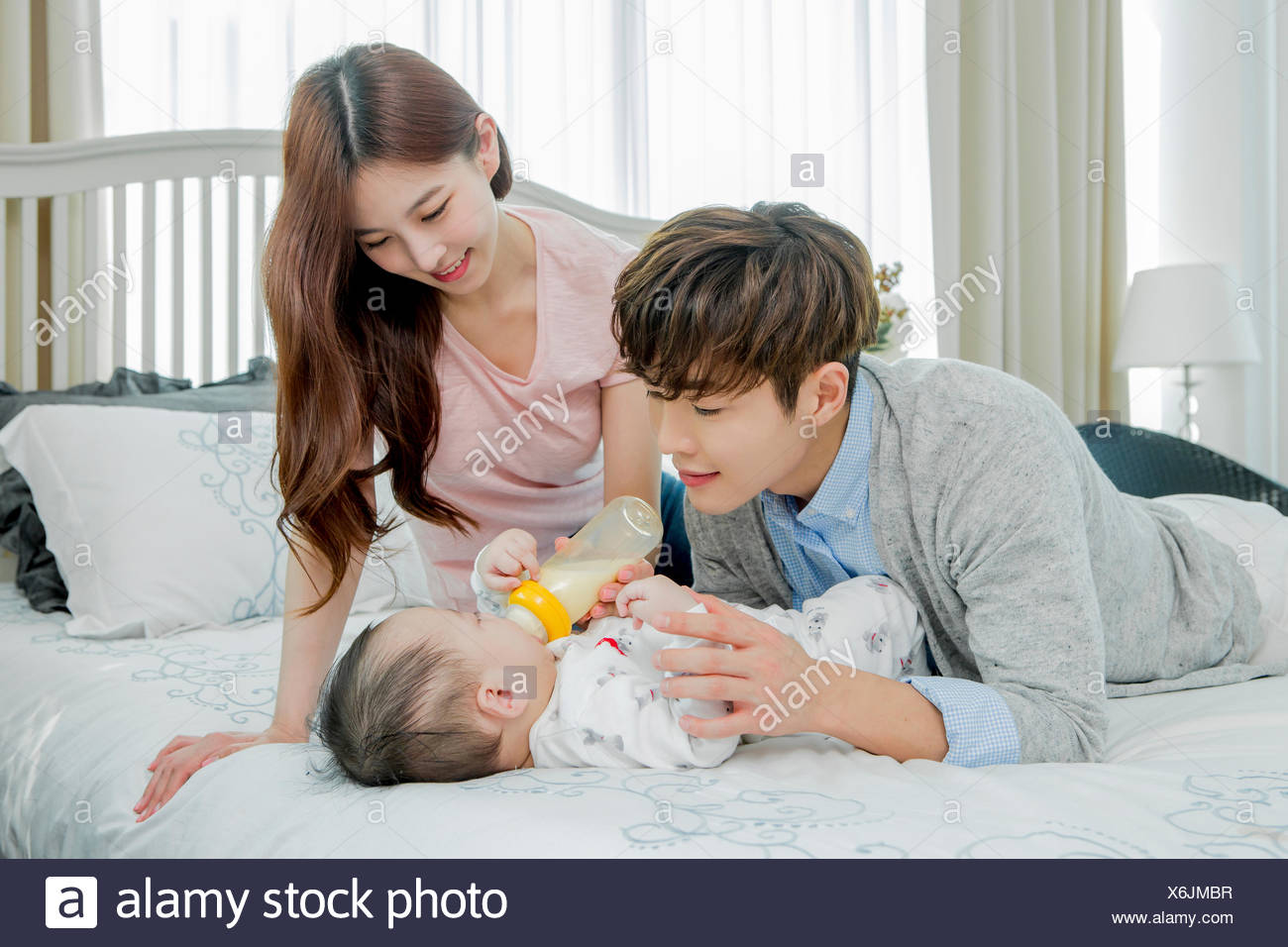 father taking care of baby