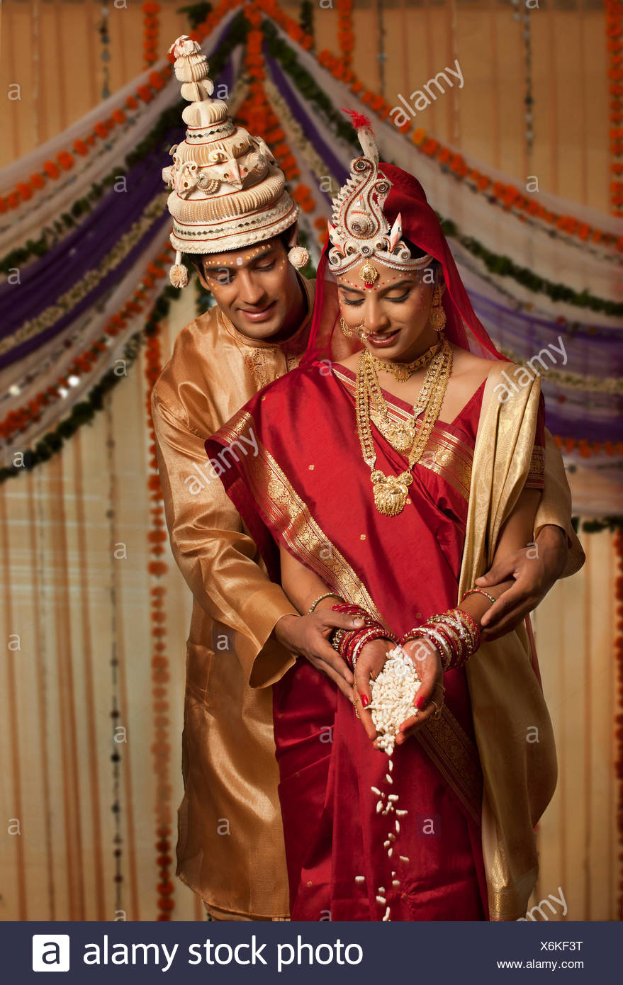 groom making an offering Stock Photo 