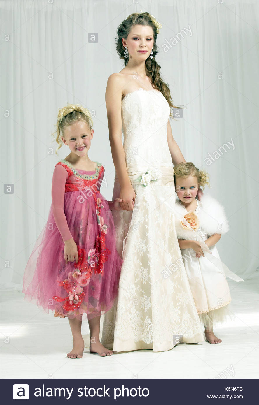 Brunette Female Curly Hair Wearing A Flolength Strapless