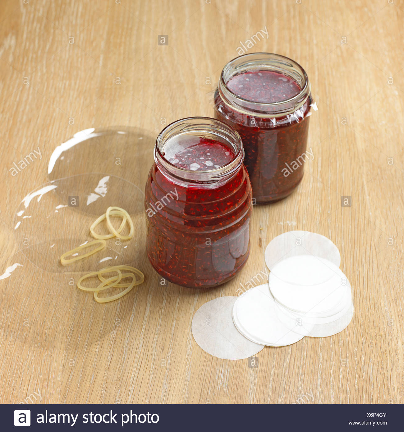 Jars Of Raspberry Jam With Waxed Paper Discs And Cellophane Covers Close Up Stock Photo Alamy