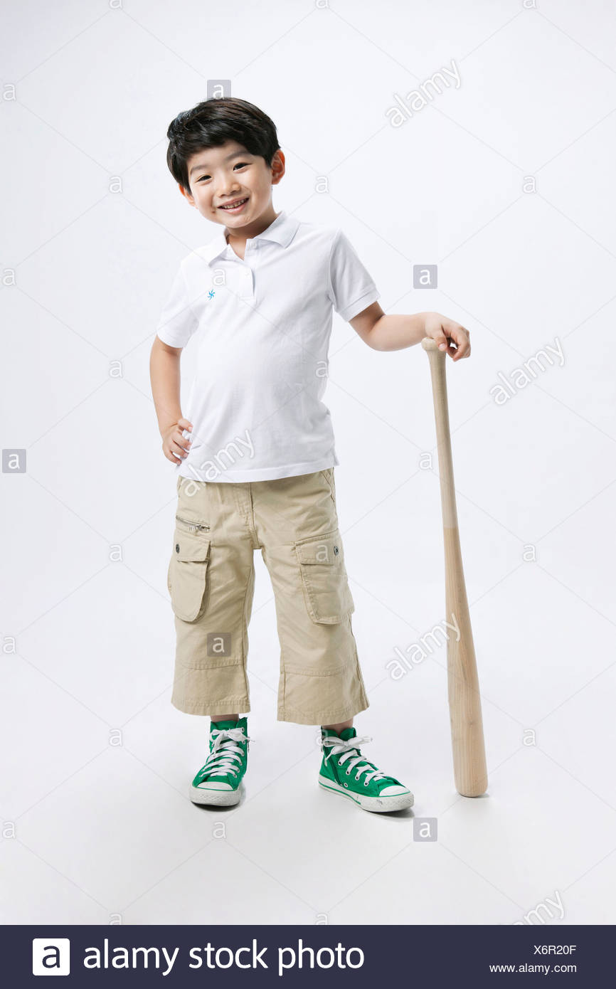 Little boy holding a baseball bat Stock Photo - Alamy