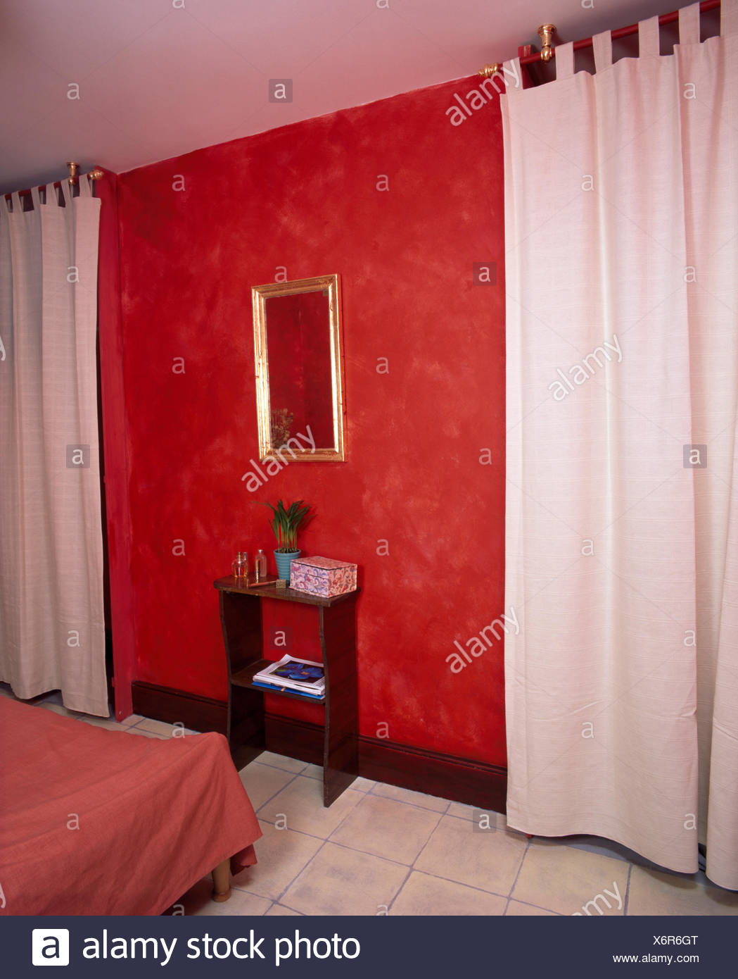 White Curtains In Red Economy Style Nineties Bedroom Stock