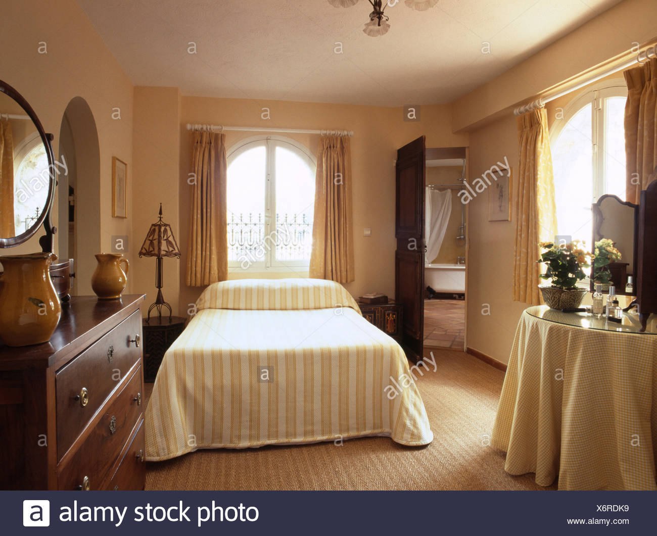 Pale Yellow Striped Quilt On Bed In French Country Bedroom
