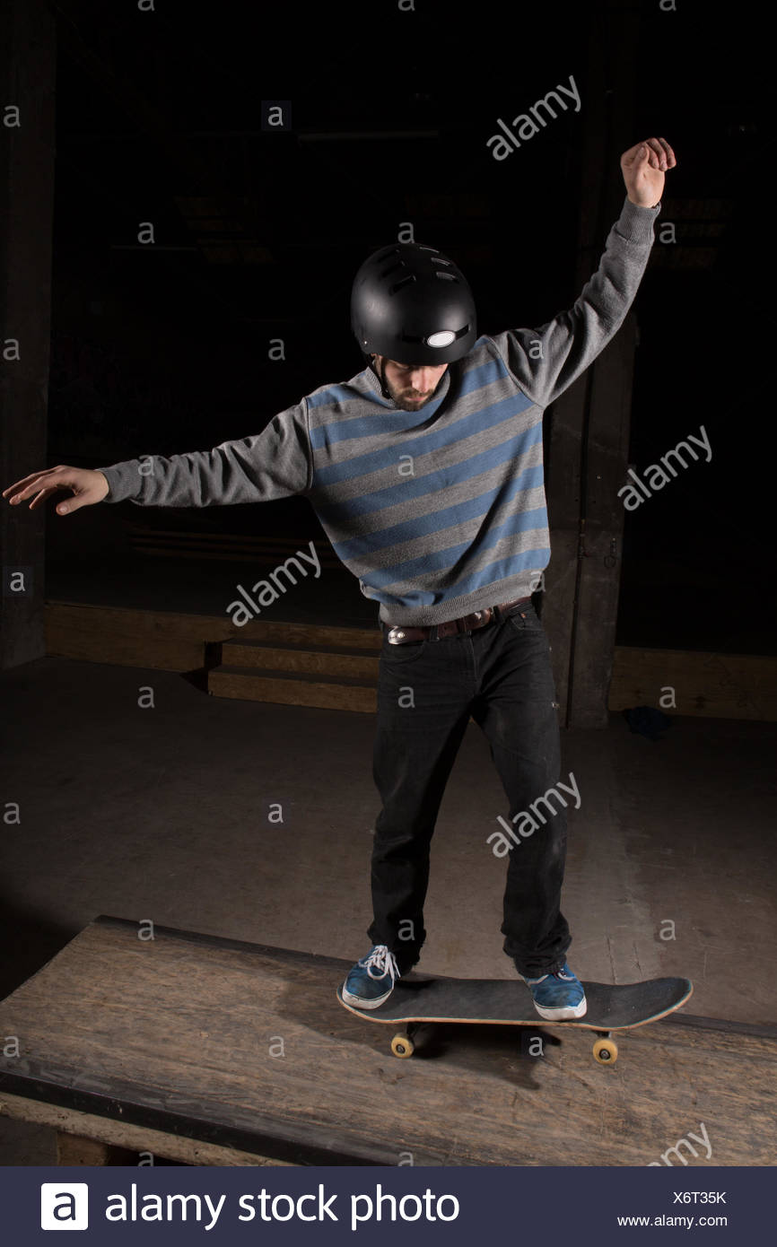Skater doing manual trick on manual pad Stock Photo - Alamy